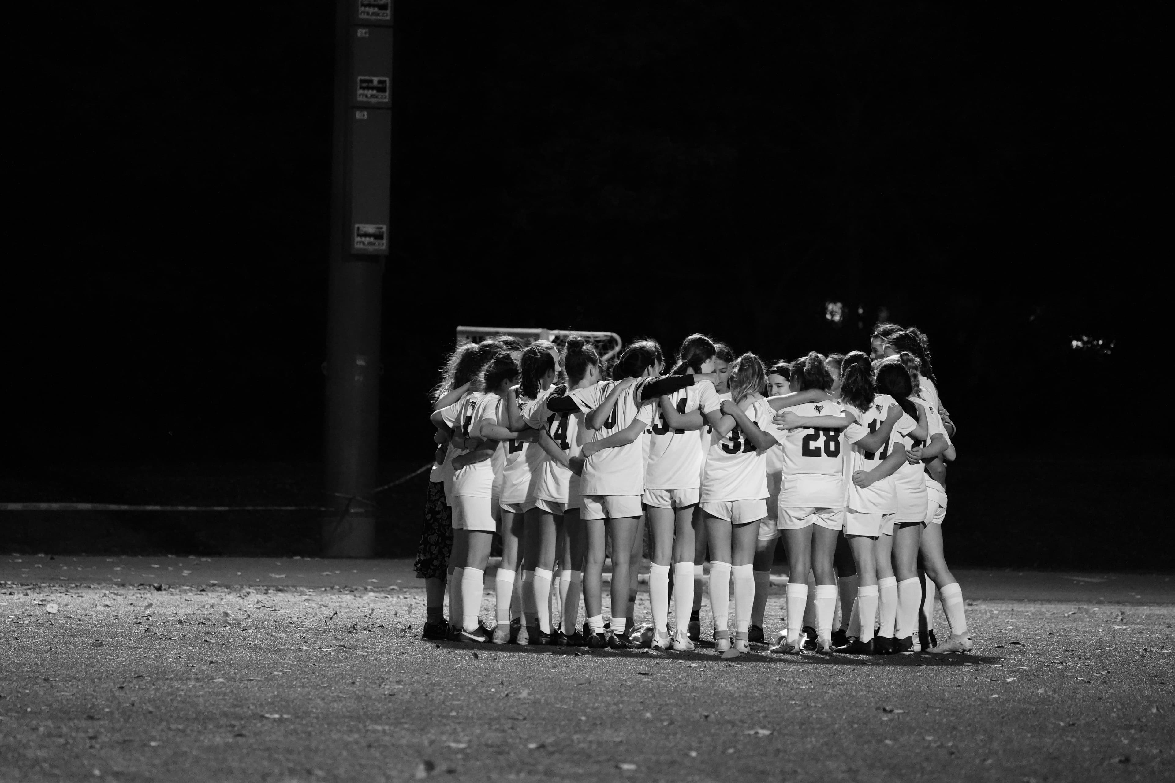 Girls soccer team huddle